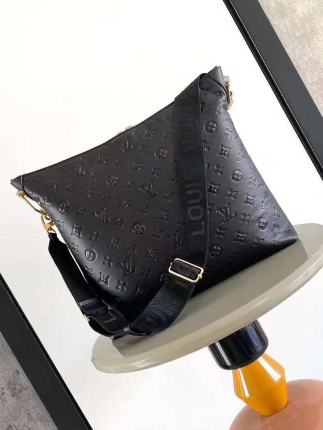 LOUIS VUITTON- LAMBSKIN EMBOSSED MONOGRAM COUSSIN