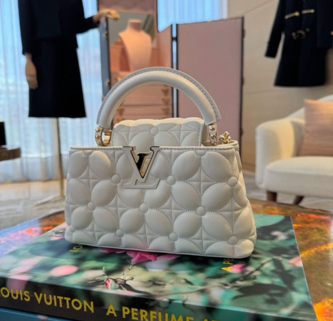 LOUIS VUITTON- WOMEN - HANDBAGS CAPUCINES EAST-WEST MM