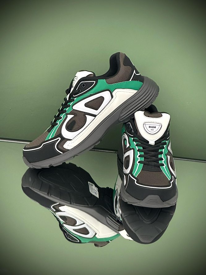 Dior B30 sneakers in black, green, and white with mesh and leather panels, featuring the bold .
