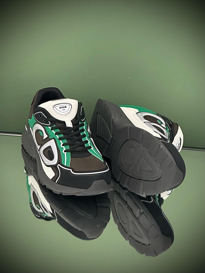 Dior B30 sneakers in black, green, and white with mesh and leather panels, featuring the bold .