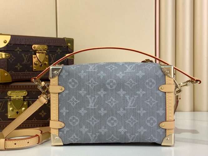 A compact Louis Vuitton trunk-style bag in denim canvas with monogram pattern, natural leather trim, and silver-tone hardware.