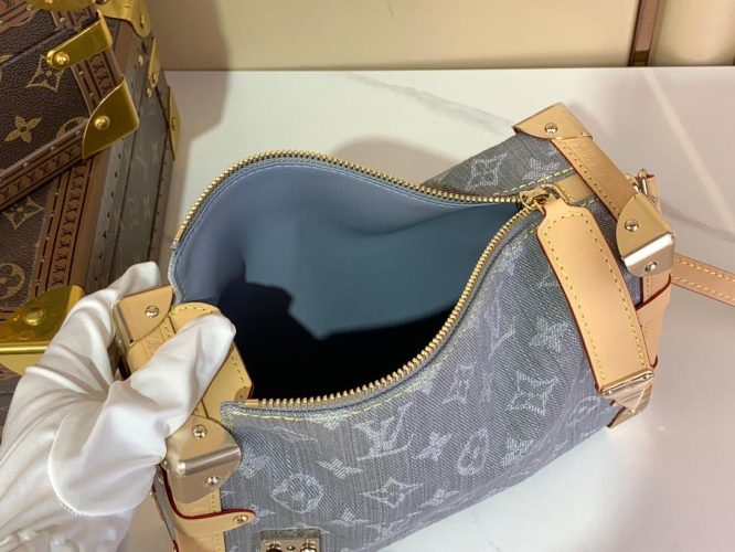 A compact Louis Vuitton trunk-style bag in denim canvas with monogram pattern, natural leather trim, and silver-tone hardware.