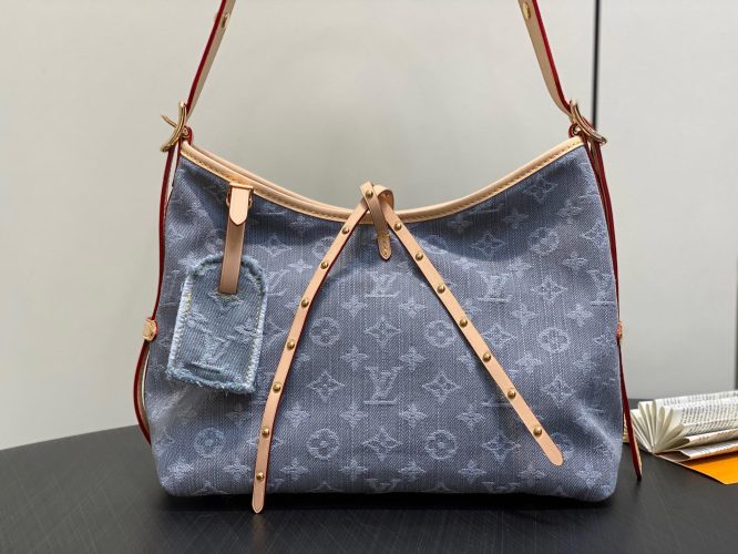 Louis Vuitton Monogram Denim Hobo Bag – a casual shoulder bag in blue denim with leather trim and signature monogram pattern.
