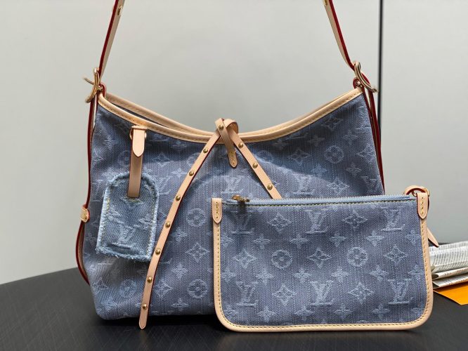 Louis Vuitton Monogram Denim Hobo Bag – a casual shoulder bag in blue denim with leather trim and signature monogram pattern.