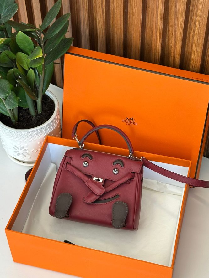 Playful mini Hermès bag with a cute face design.